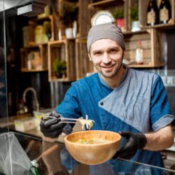 Chief cook at the asian restaurant kitchen