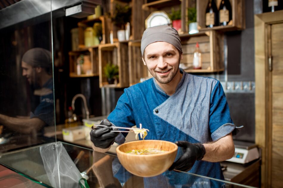 Chief cook at the asian restaurant kitchen