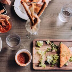 Overhead food flat lay of people having Italian food at restaurant