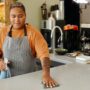 Restaurant Worker Wiping Off Dust