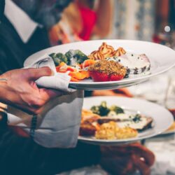 Serving food on warm plates in the restaurant.